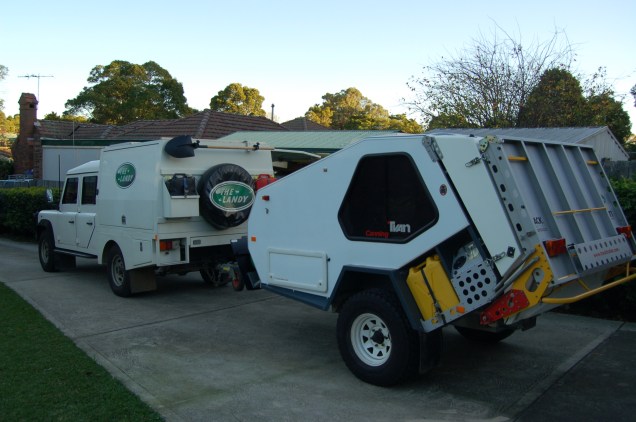 The Landy and T-Van heading down the driveway